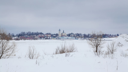 View of Myshkin town from other bank of Volga river in winter