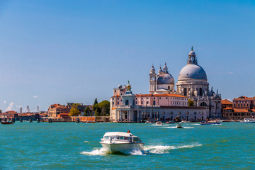 The iconic Grand Canal in Venice, busy with tourists and tourboats. 
