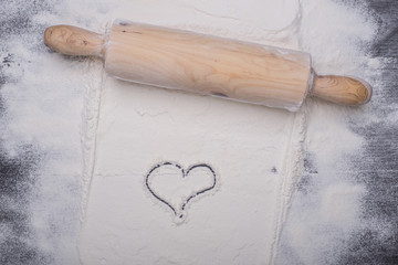 baking ingredients eggs, flour, sugar, butter, yeast. dough preparation. food background