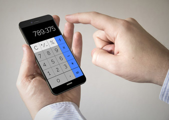  touchscreen smartphone with calculator app on the screen