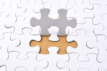 Puzzle on brown background. Team business concept