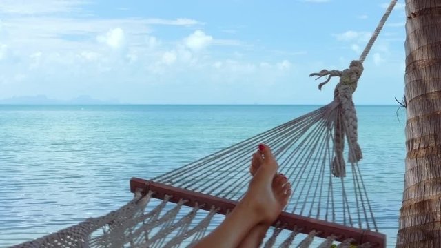 Woman relaxing on the hammock