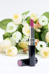 shiny rosy pink lip stick whit artificail flowers
