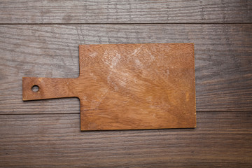 Background with cutting board on wooden table