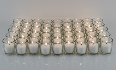 White Votive Candles in Glass Holders