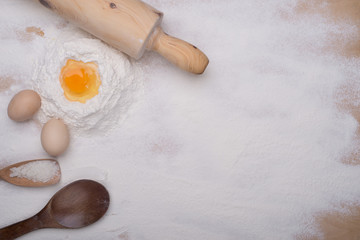 baking ingredients eggs, flour, sugar, butter, yeast. dough preparation. food background