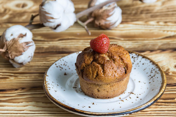 Homemade sweet muffins with strawberries and chocolate