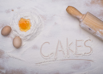 baking ingredients eggs, flour, sugar, butter, yeast. dough preparation. food background