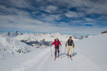 Fototapeta na wymiar Two elderly men practice ski mountaineering