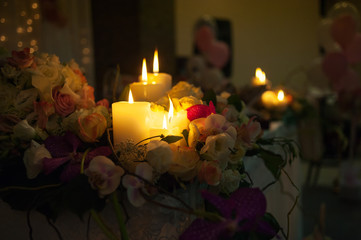 Lighted candles on a wedding table bride and groom
