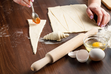 Fototapeta na wymiar Croissants making on wood table with flour