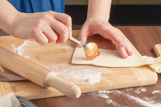 Croissants making on wood table with flour