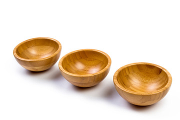 Top view of wooden bowl on white background, isolated