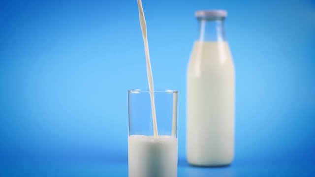 Milk pouring into glass