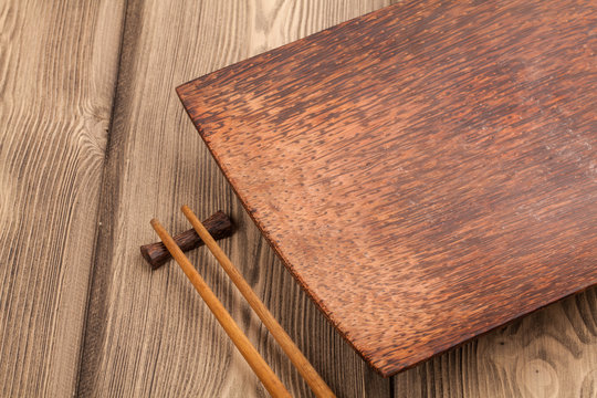 Empty dishes for sushi and rolls on wood table