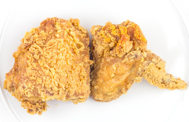 Fried chicken in white plate,top view on isolate