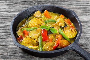 vegetarian curry with zucchini, eggplants, carrots, bell pepper,