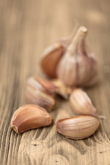Fresh garlic on wooden table, selective focus.Close-up studio ph
