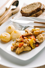 Chicken and peppers served with sweet and sour onions

