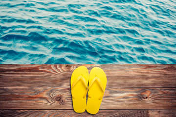 Yellow flip flops and sunglasses