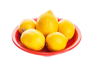 Fresh lemon in a plate isolated on a white background