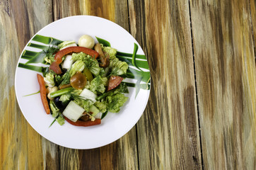 Salad with cabbage, tomatoes and pepper.