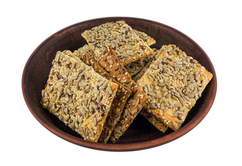 puff cookie with sesame seeds on a clay plate. diet.