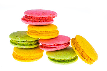 Fototapeta na wymiar Sweet beautiful colored French almond biscuits on a white background close-up