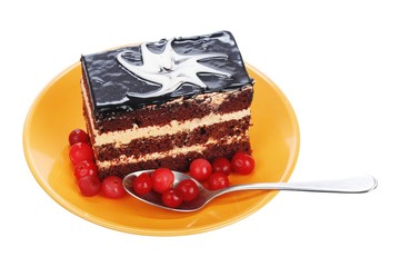 Chocolate cake with cranberries on orange plate