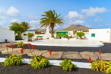 Typical Canarian style buildings and tropical plants, El Campesino village, Lanzarote island, Spain © pkazmierczak