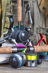 fishing tackles with fishing vest and boots