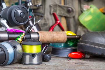 fishing tackles with fishing vest and boots