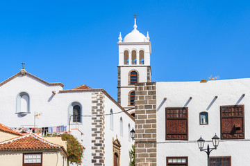 Fototapeta na wymiar Church tower and historical colonial buildings in Garachico old town, Tenerife, Canary Islands, Spain