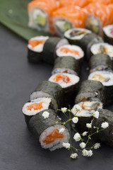 Sushi set over black background