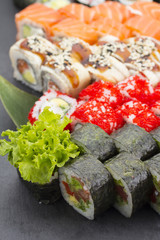 Sushi set over black background