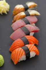 Sushi nigiri set over black background