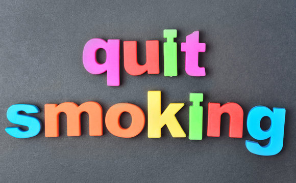 Quit smoking words on background