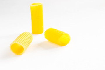 Pasta in the form of tubes closeup on a white background