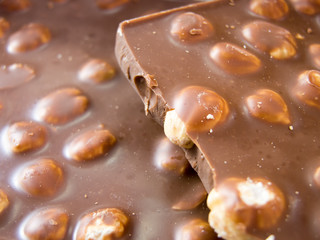 broken piece of delicious almond chocolate