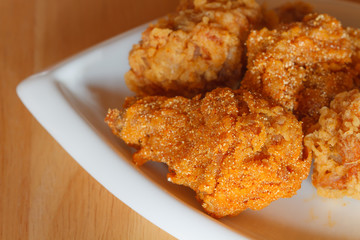 Fresh fried chicken on a white plate