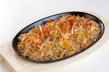 wok noodles rice glass with vegetables carrots pepper leek