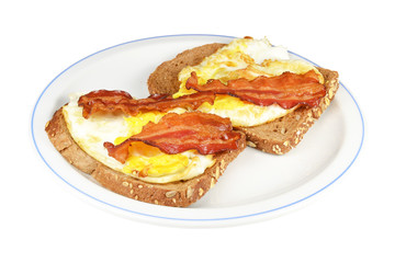 Bread with fried egg and bacon.