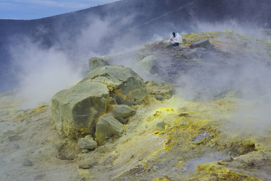 Geologists taking minerals samples on Gran Cratere (The Great Crater), Vulcano Island, Aeolian Islands, north of Sicily, Mediterranean