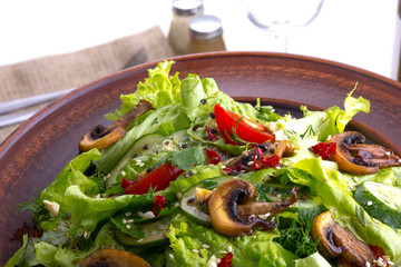 vegetable salad - cold appetizer of fried mushrooms with lettuce and tomatoes