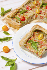 Pie with cheese, tomatoes, herbs and spices