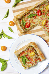 Pie with cheese, tomatoes, herbs and spices