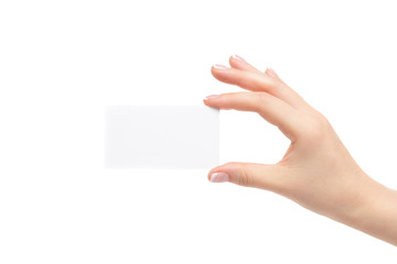Obraz premium Female hand holds white card on a white background.