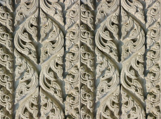 Cement craft Thailand style background on the wall at public temple.