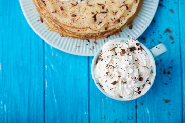 Hot cappuccino and pancakes