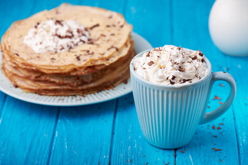 Hot cappuccino and pancakes